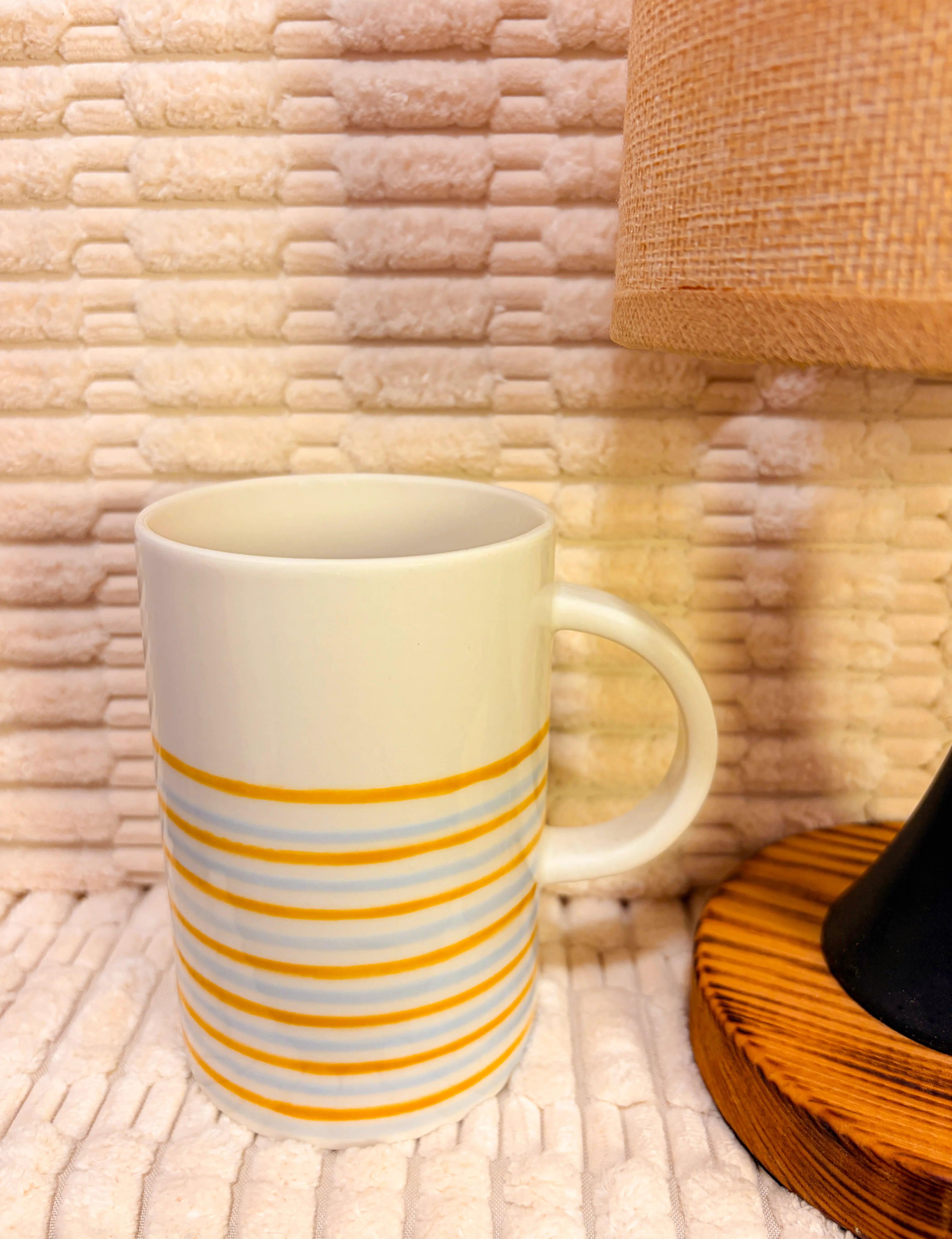 White mug with blue & yellow rims
